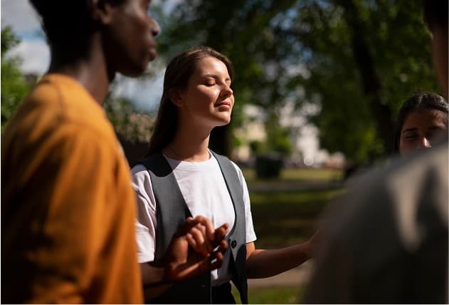 Mindfulness circle at The Grove — guided outdoor meditation during the Spiritual Track