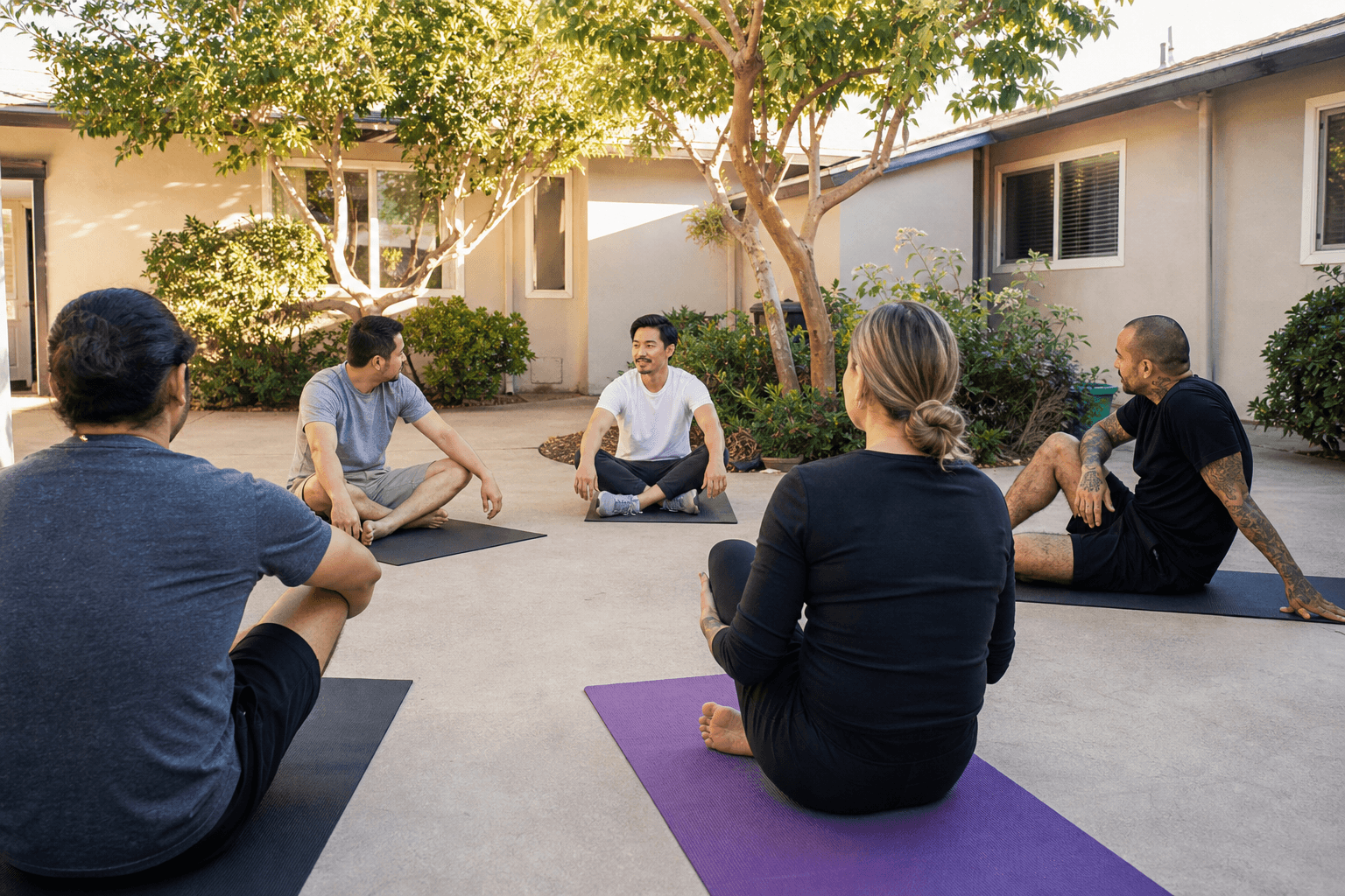 Group yoga class on the lawn at Northbound's Garden Grove rehab — wellness in recovery