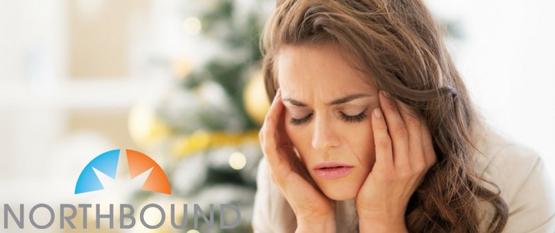 tackle-holiday-stress-stressed-young-woman-near-christmas-tree-nbblog1