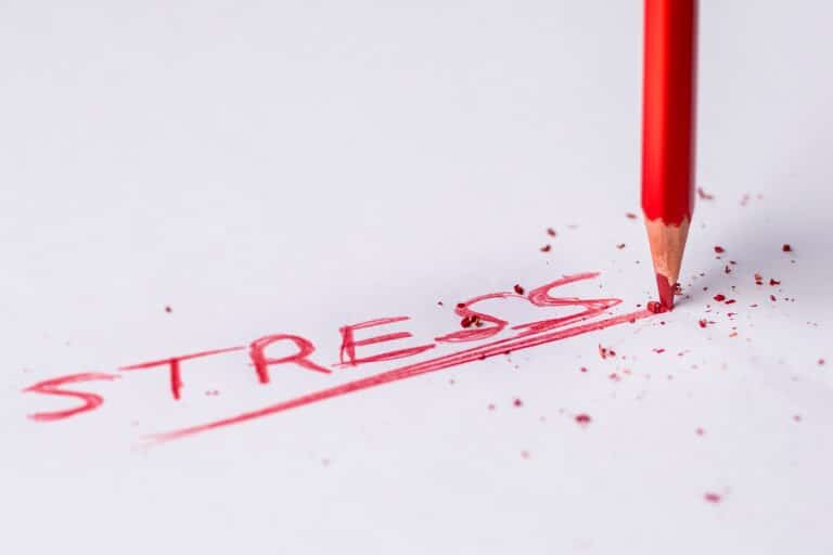 the word stress written aggressively with a colored pencil